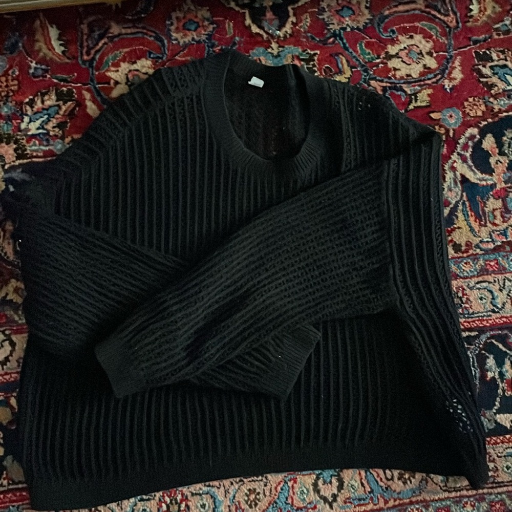 Black crochet-like crew neck sweater
